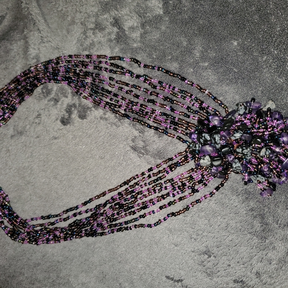Beautiful purple beaded necklace draped